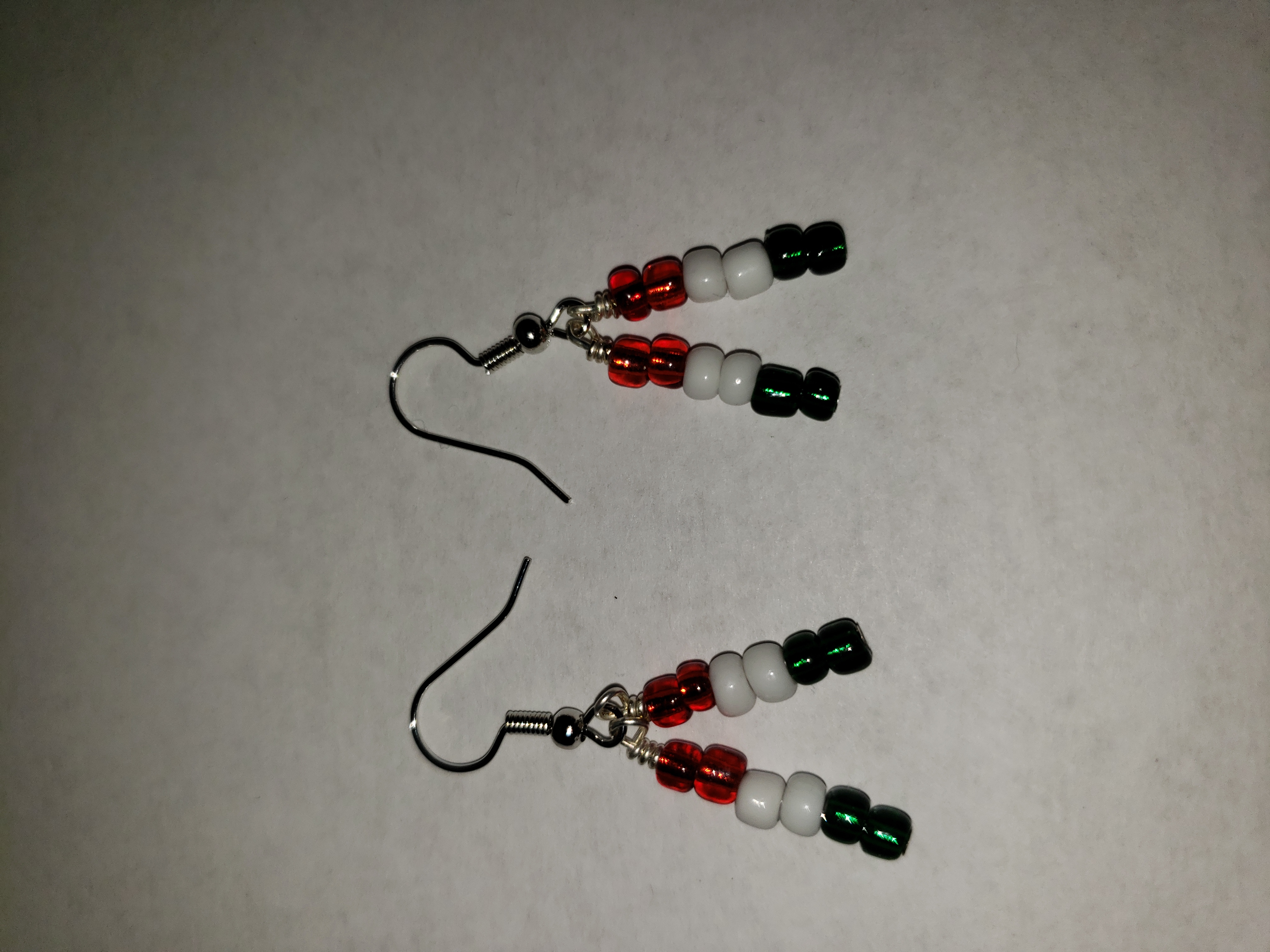 Dangle earrings; red, white, and green.